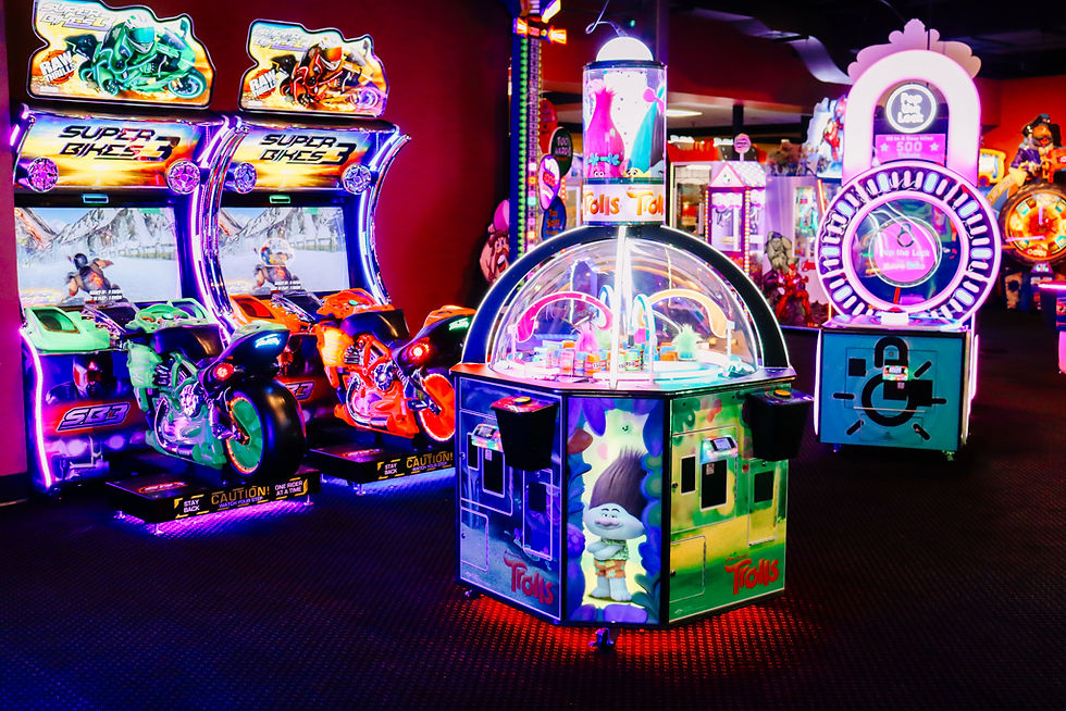 Brightly lit arcade game area with ticket games and claw machines at King’s Entertainment