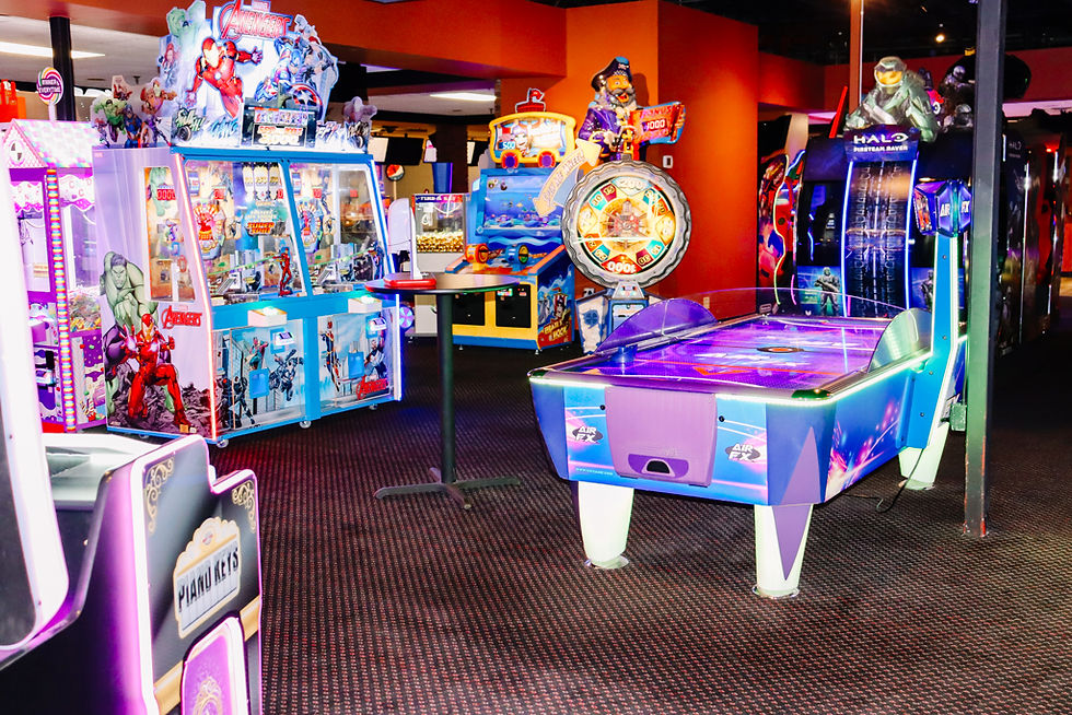 Purple-themed prize games and coin pushers at King’s Entertainment arcade