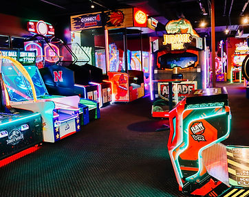 Vibrant arcade with racing and video games at King’s Entertainment in Norfolk, Nebraska