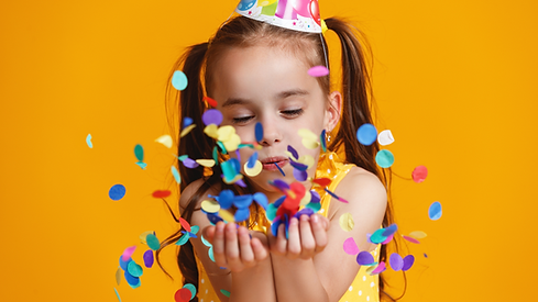 Child celebrating a birthday party with confetti at King’s Entertainment in Norfolk, NE