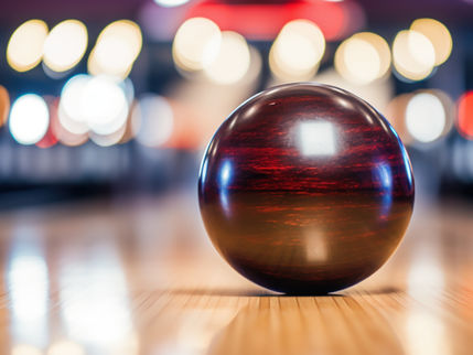 bowling ball sitting on bowling lane